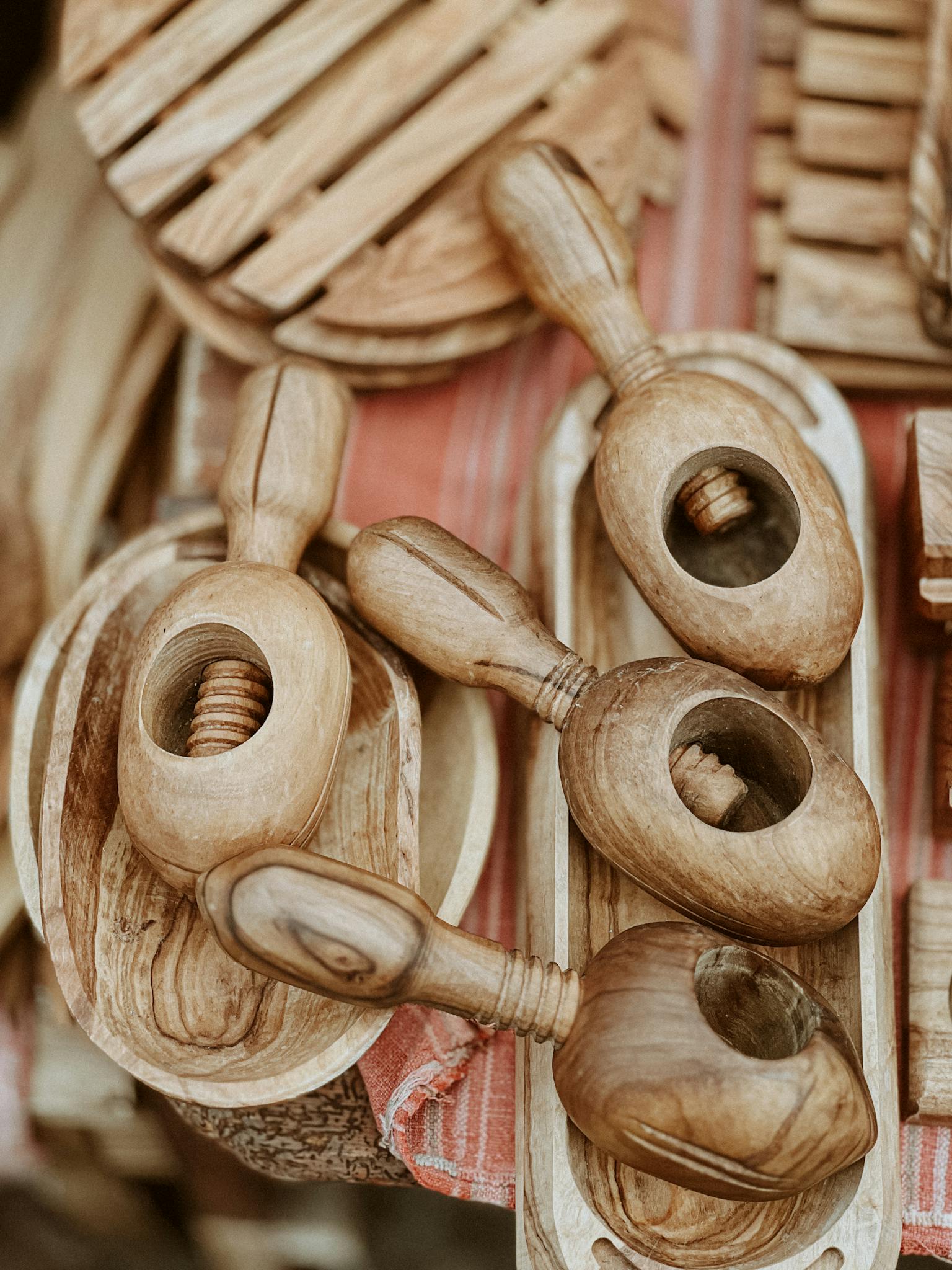 Close-up of rustic wooden bowls and tools, showcasing handmade craftsmanship.
